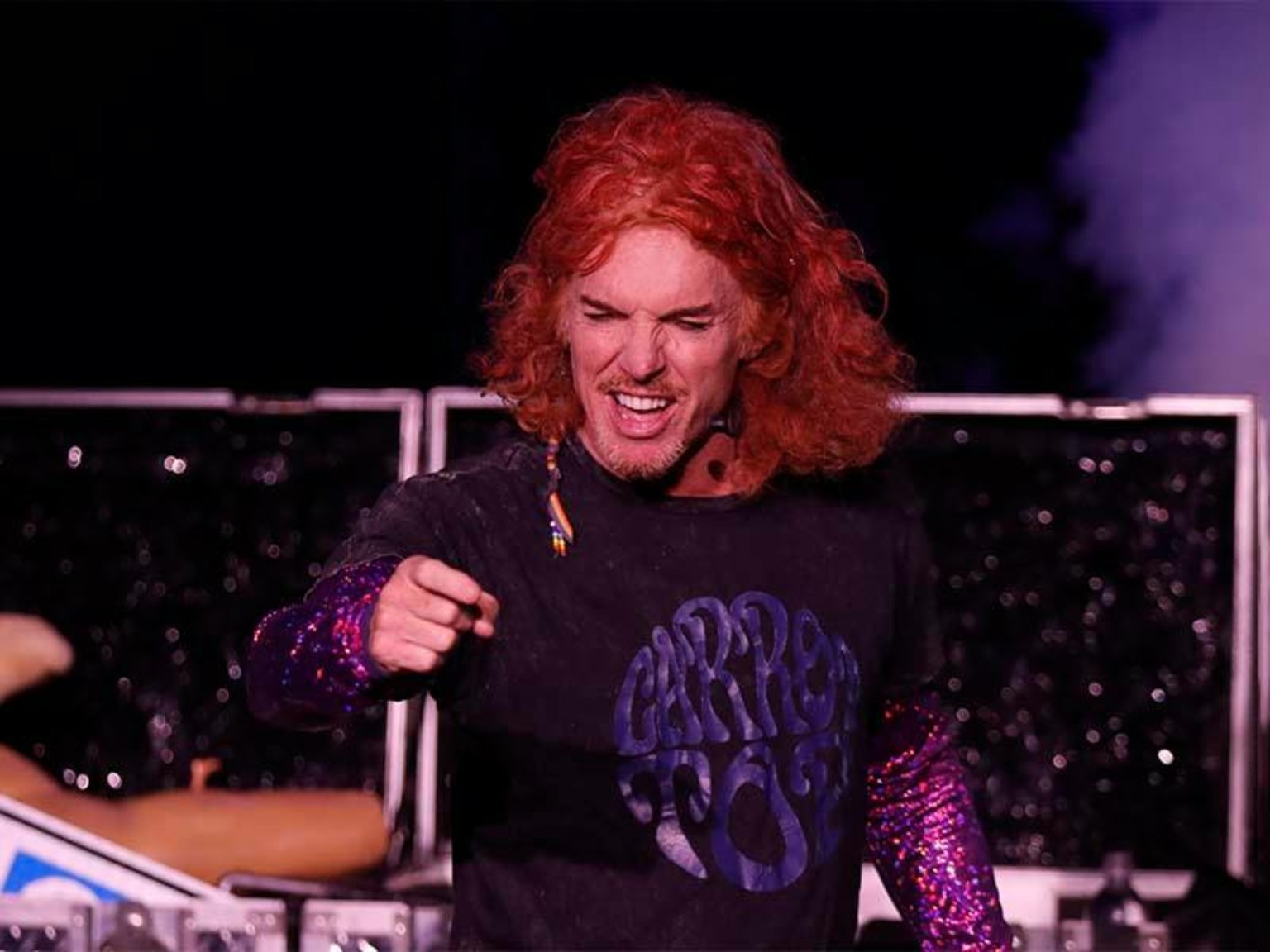 Carrot Top onstage pointing during his Las Vegas show at Luxor