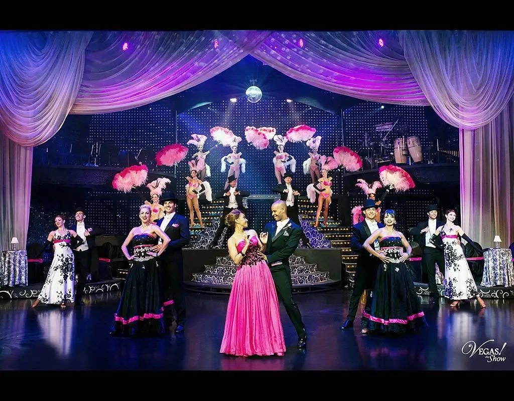 VEGAS! The Show performers with feather fans